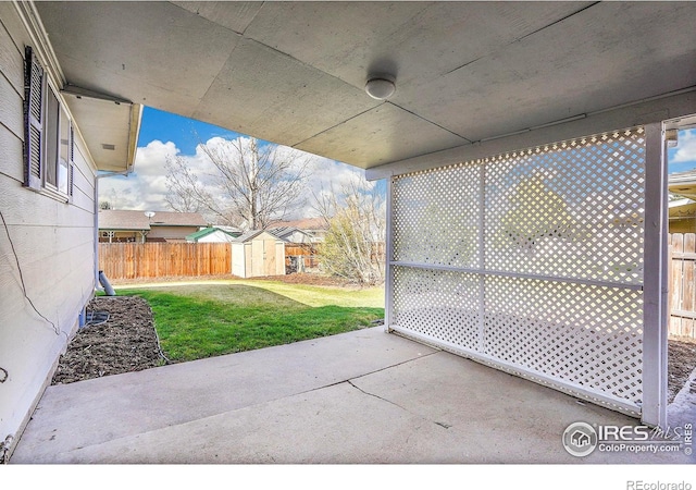 3735 W 8th St, Greeley, CO 80634 - view of patio with a shed, an outdoor structure, and fence