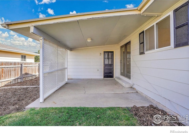 3735 W 8th St, Greeley, CO 80634 - view of patio / terrace with fence and an attached carport