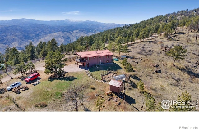 13236 Otter Rd, Loveland, CO 80538 - overview of rural landscape with mountains and a heavily wooded area