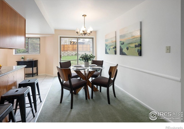 2610 Heidelberg Dr, Boulder, CO 80305 - dining space featuring a chandelier, plenty of natural light, baseboards, and light colored carpet