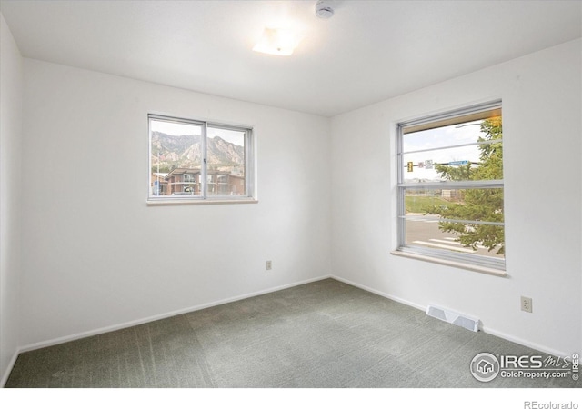 2610 Heidelberg Dr, Boulder, CO 80305 - empty room featuring carpet flooring, baseboards, and visible vents
