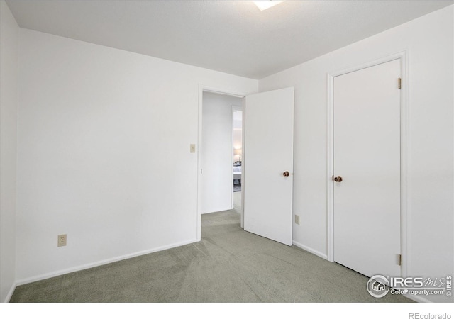 2610 Heidelberg Dr, Boulder, CO 80305 - unfurnished bedroom with carpet floors and baseboards
