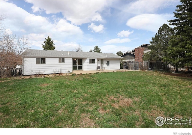 2610 Heidelberg Dr, Boulder, CO 80305 - back of house featuring a yard, a patio, and fence