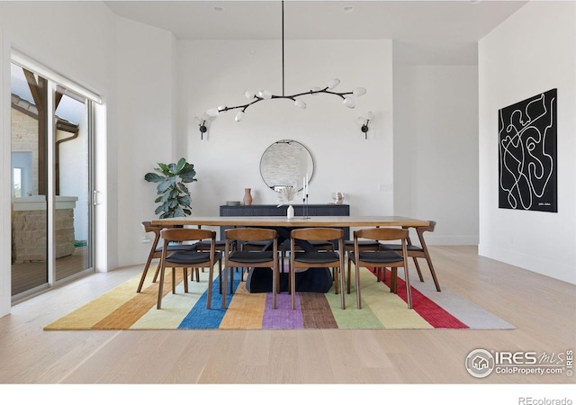 dining room featuring wood finished floors and baseboards