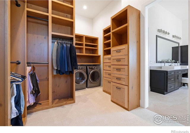 washroom with laundry area, light carpet, washing machine and dryer, and recessed lighting