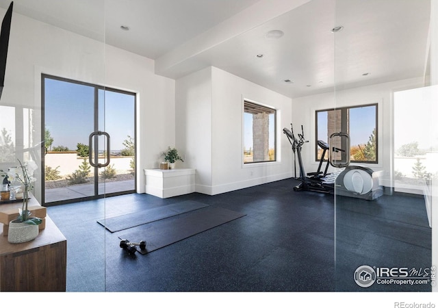 workout area with recessed lighting and baseboards
