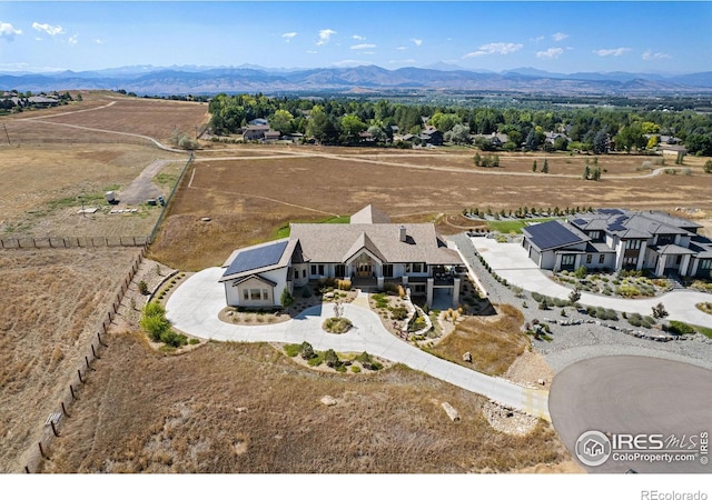 drone / aerial view with a rural view and a mountain view