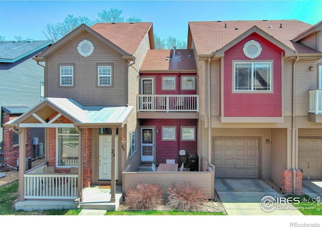 835 Kane Dr Unit 25, Longmont, CO 80501 - townhome / multi-family property with central air condition unit, concrete driveway, and a garage