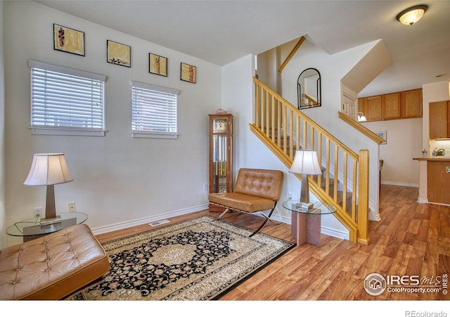 835 Kane Dr Unit 25, Longmont, CO 80501 - living area with stairs, visible vents, light wood-type flooring, and baseboards