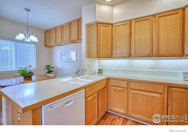 835 Kane Dr Unit 25, Longmont, CO 80501 - kitchen featuring an inviting chandelier, dishwasher, a sink, light countertops, and a peninsula