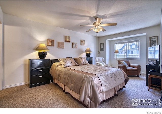 835 Kane Dr Unit 25, Longmont, CO 80501 - bedroom with baseboards, a ceiling fan, and light colored carpet