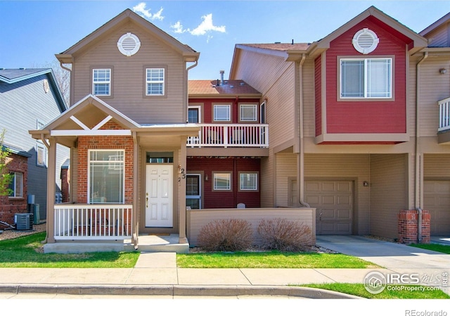 835 Kane Dr Unit 25, Longmont, CO 80501 - multi unit property with a garage, a porch, central air condition unit, and driveway