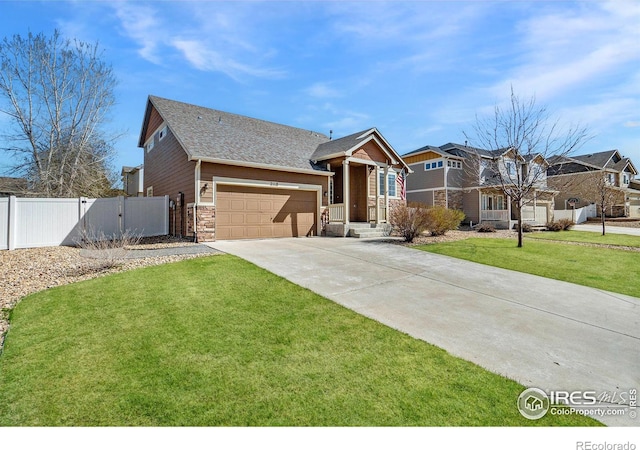 2118 74th Avenue Ct, Greeley, CO 80634 - view of front facade featuring a garage, fence, a front lawn, a gate, and driveway