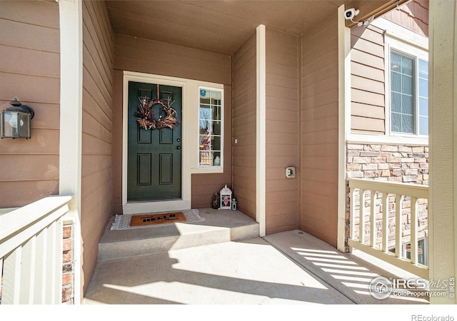 2118 74th Avenue Ct, Greeley, CO 80634 - entrance to property with covered porch and stone siding