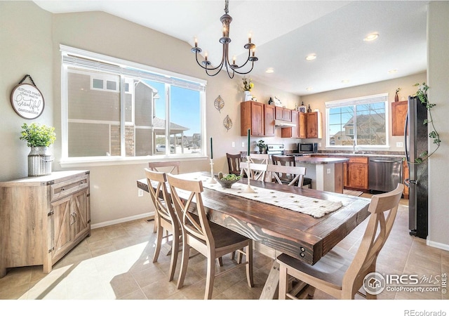 2118 74th Avenue Ct, Greeley, CO 80634 - dining space featuring light tile patterned floors, baseboards, recessed lighting, and a chandelier
