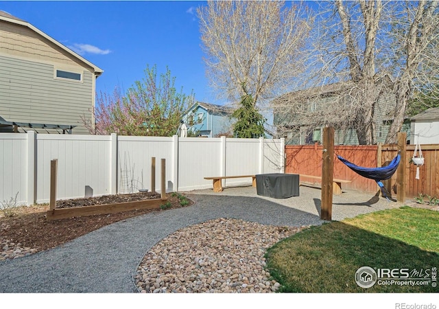 2118 74th Avenue Ct, Greeley, CO 80634 - view of yard with a garden, a patio, and a fenced backyard
