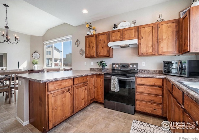 2118 74th Avenue Ct, Greeley, CO 80634 - kitchen featuring brown cabinetry, appliances with stainless steel finishes, vaulted ceiling, and under cabinet range hood