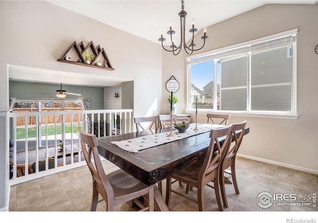 2118 74th Avenue Ct, Greeley, CO 80634 - tiled dining space featuring a wealth of natural light, ceiling fan with notable chandelier, baseboards, and lofted ceiling