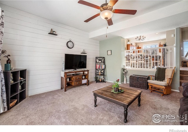 2118 74th Avenue Ct, Greeley, CO 80634 - carpeted living area with wood walls and a ceiling fan