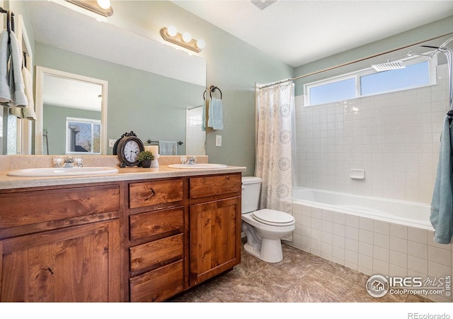 2118 74th Avenue Ct, Greeley, CO 80634 - full bathroom featuring a sink, toilet, double vanity, and tiled shower / bath