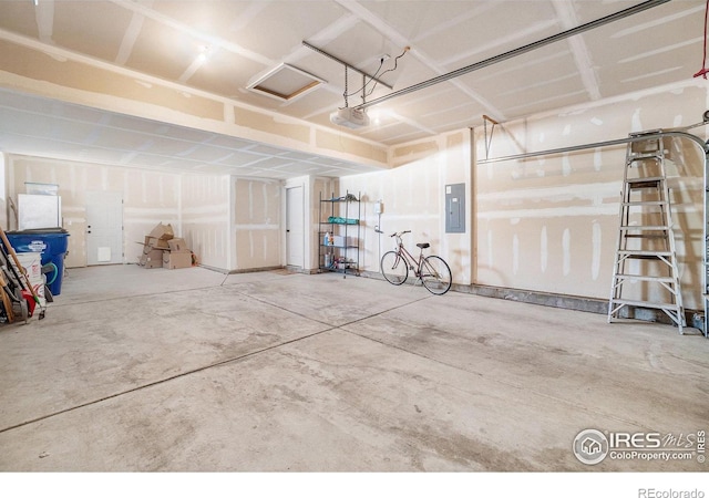 2118 74th Avenue Ct, Greeley, CO 80634 - garage featuring electric panel and a garage door opener