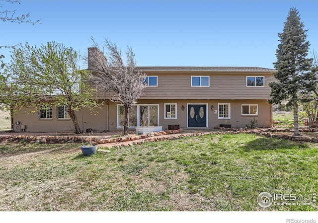 3786 Eldorado Springs Dr, Boulder, CO 80303 - view of front of house featuring stucco siding and a front lawn