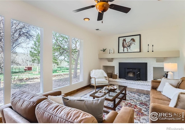 3786 Eldorado Springs Dr, Boulder, CO 80303 - living room with ceiling fan, visible vents, wood finished floors, and a fireplace