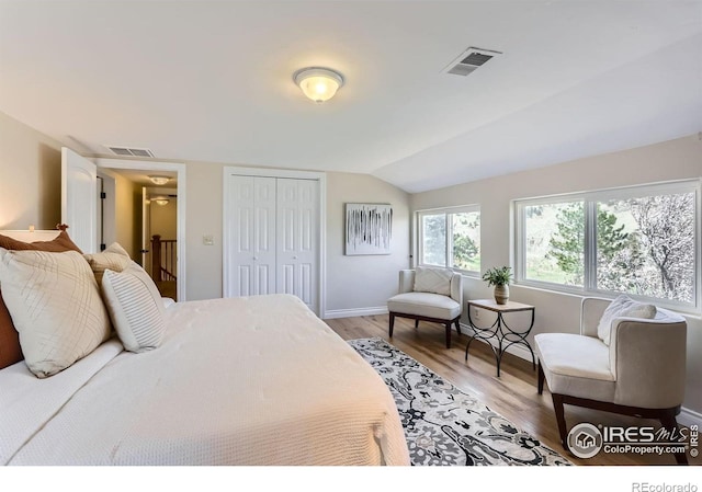 3786 Eldorado Springs Dr, Boulder, CO 80303 - bedroom featuring light wood-style floors, baseboards, vaulted ceiling, and visible vents