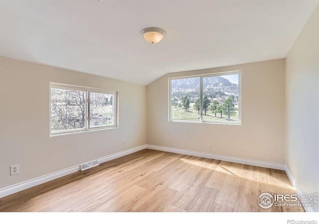 3786 Eldorado Springs Dr, Boulder, CO 80303 - unfurnished room with visible vents, light wood finished floors, baseboards, and vaulted ceiling
