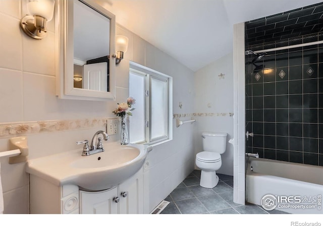 3786 Eldorado Springs Dr, Boulder, CO 80303 - full bath with shower / tub combination, tile patterned flooring, vanity, toilet, and tile walls