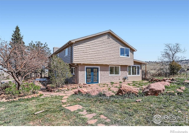3786 Eldorado Springs Dr, Boulder, CO 80303 - exterior space featuring french doors and brick siding
