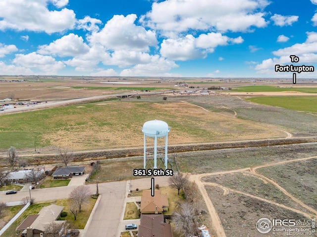 birds eye view of property with a rural view