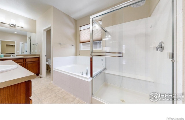5543 Calgary St, Timnath, CO 80547 - full bathroom featuring a shower stall, toilet, vanity, a bath, and tile patterned floors
