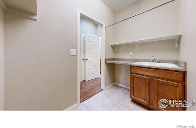 5543 Calgary St, Timnath, CO 80547 - washroom featuring a sink and baseboards