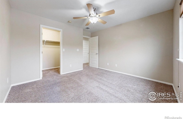 5543 Calgary St, Timnath, CO 80547 - unfurnished bedroom with carpet flooring, a walk in closet, baseboards, ceiling fan, and a closet