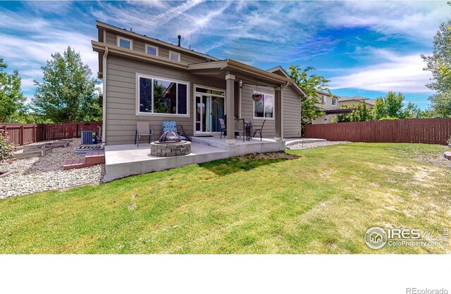 5543 Calgary St, Timnath, CO 80547 - back of property with a patio, an outdoor fire pit, and central AC unit