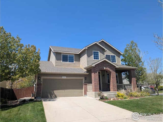 5543 Calgary St, Timnath, CO 80547 - view of front of house featuring brick siding, covered porch, driveway, a garage, and a shingled roof