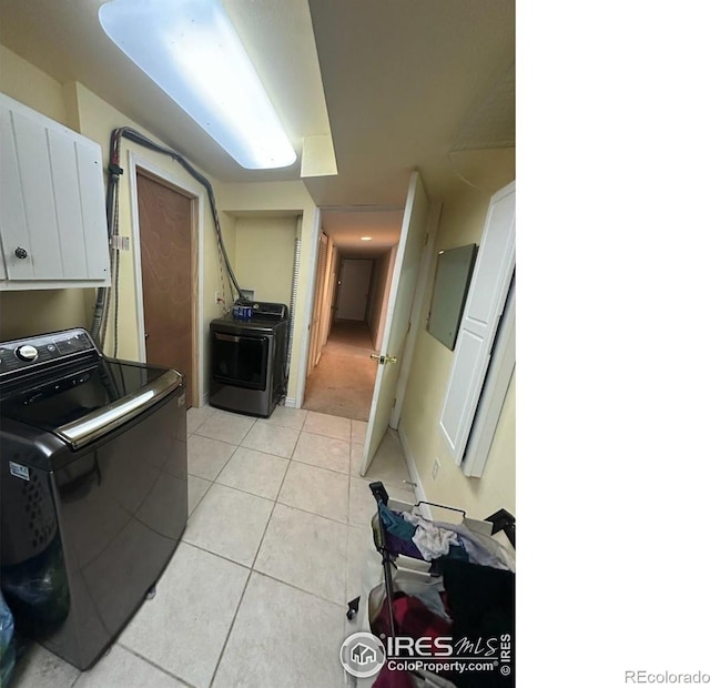 2706 Balmoral Ct, Fort Collins, CO 80525 - kitchen with washer / clothes dryer, white cabinets, and light tile patterned floors