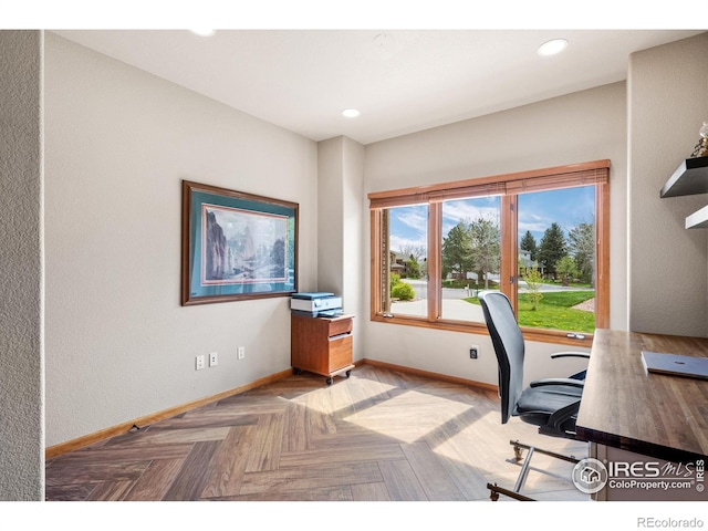 unfurnished office with recessed lighting and baseboards