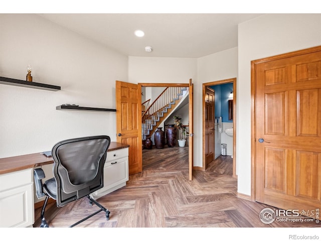 office with baseboards and recessed lighting