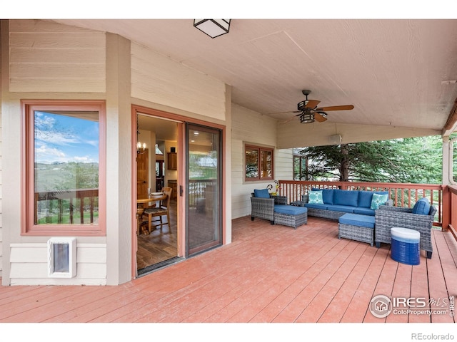 wooden deck featuring ceiling fan, outdoor lounge area, and visible vents
