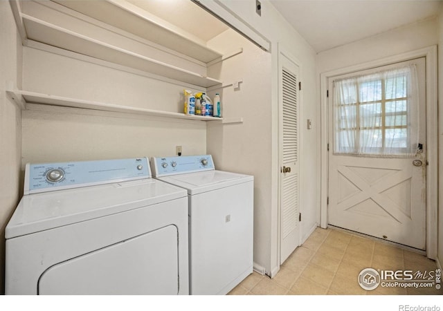 198 Poudre River Rd, Bellvue, CO 80512 - washroom with separate washer and dryer, laundry area, baseboards, and light tile patterned floors