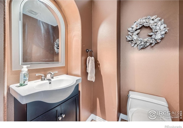357 W Harper St, Louisville, CO 80027 - bathroom with vanity, visible vents, and toilet