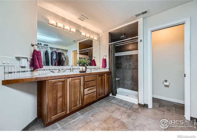 357 W Harper St, Louisville, CO 80027 - bathroom with a sink, visible vents, double vanity, and a stall shower