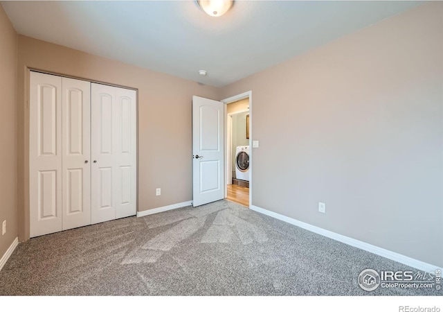 357 W Harper St, Louisville, CO 80027 - unfurnished bedroom with carpet floors, a closet, baseboards, and washer / dryer