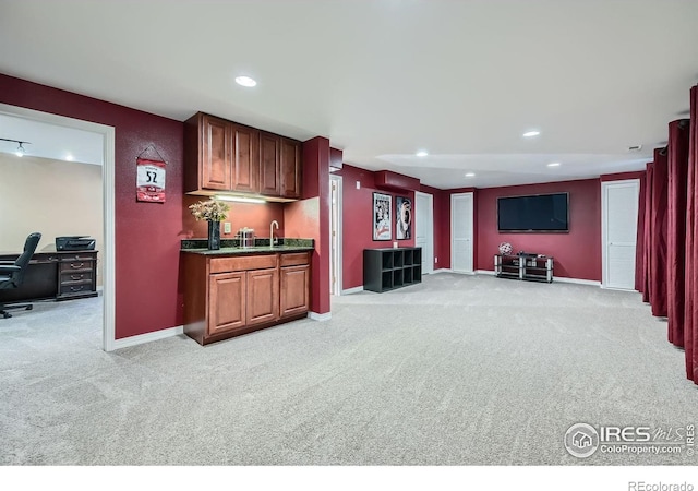 357 W Harper St, Louisville, CO 80027 - kitchen featuring dark countertops, baseboards, recessed lighting, and light colored carpet
