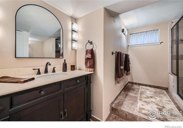 357 W Harper St, Louisville, CO 80027 - full bath with an enclosed shower, baseboards, and vanity