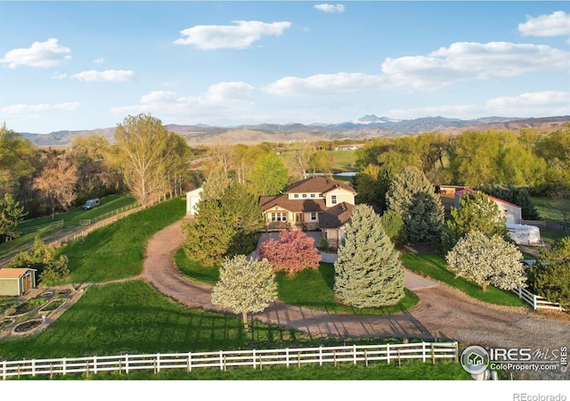 drone / aerial view featuring a rural view and a mountain view