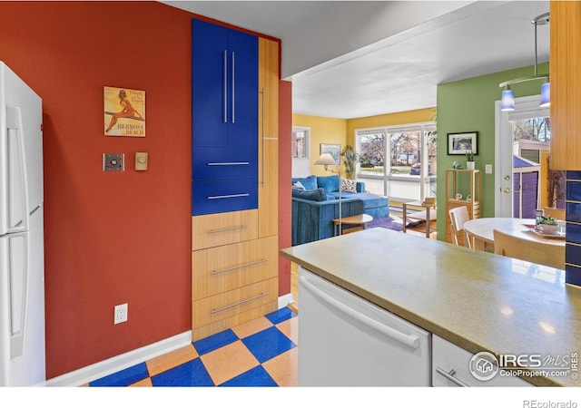 2276 Goss Cir, Boulder, CO 80302 - kitchen with white appliances, baseboards, open floor plan, and light floors
