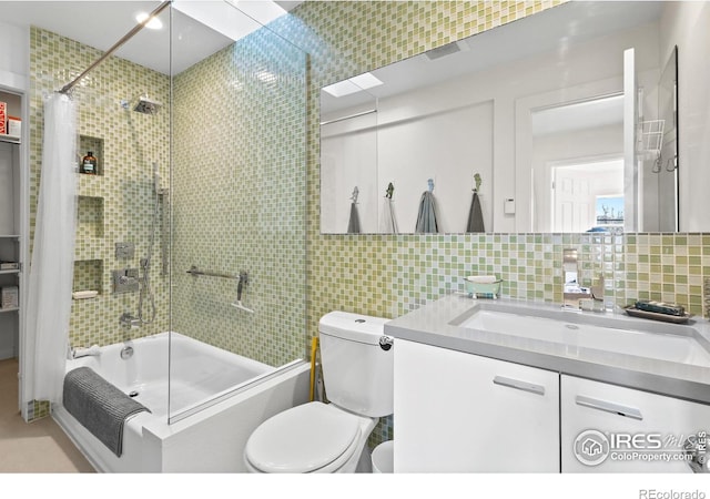 2276 Goss Cir, Boulder, CO 80302 - bathroom featuring shower / tub combo, toilet, tile walls, vanity, and decorative backsplash